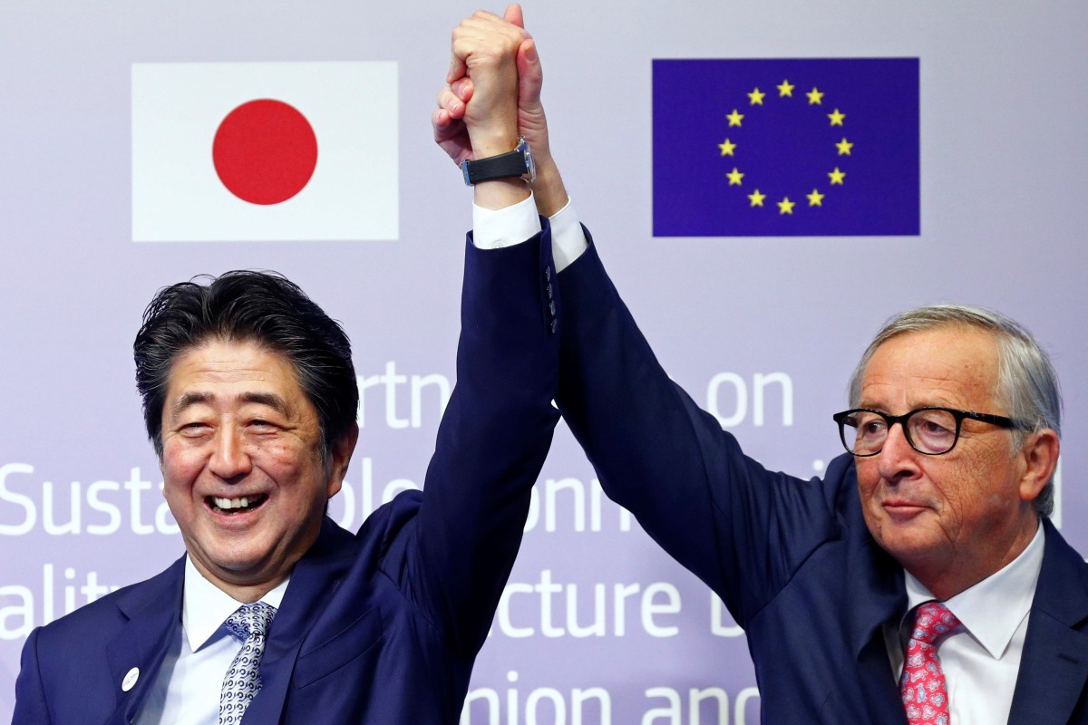 Japan’s Prime Minister Shinzo Abe (left) and European Commission President Jean-Claude Juncker mark the anniversary of the EU-Asia Connectivity scheme in Brussels, Belgium. Photo: Reuters
