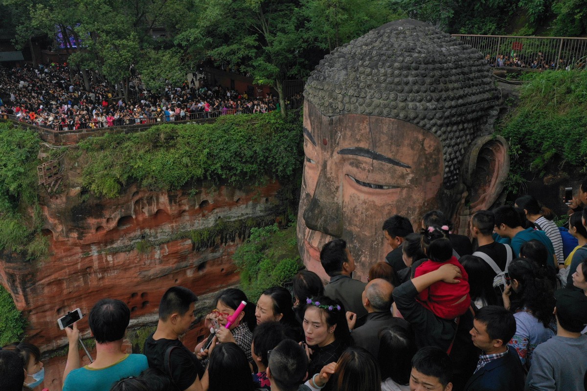 Park authorities in charge of the Leshan Giant Buddha in Sichuan have restricted visitor numbers in golden week. Photo: Xinhua