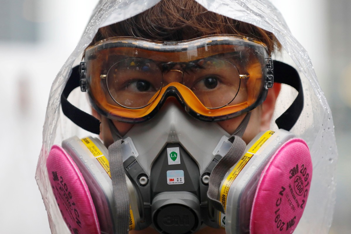 Wearing masks could be made illegal under a new Hong Kong law. Photo: Reuters
