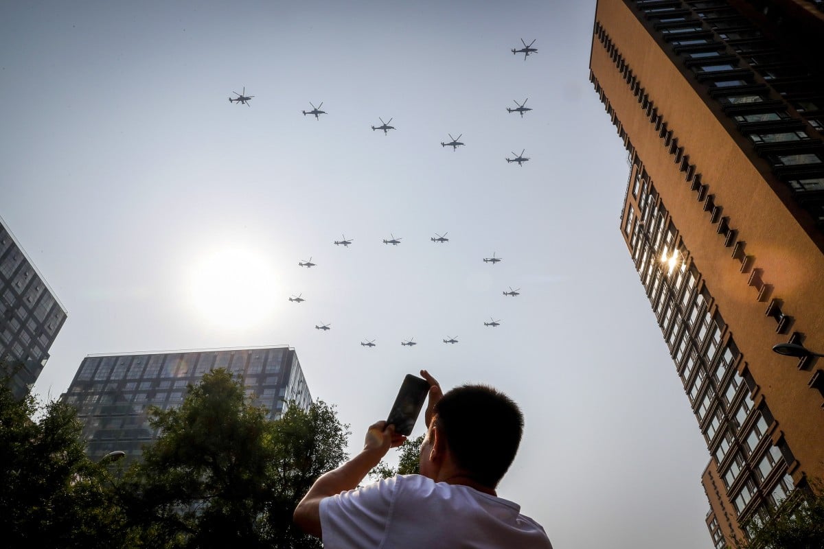 Chinese military helicopters form the number 70 as part of the National Day parade in Beijing. Photo: AP