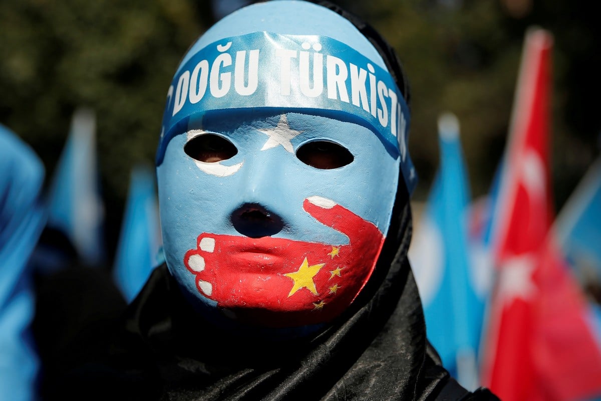 A Uygur demonstrator wears a mask while protesting against China in front of the Chinese Consulate in Istanbul, Turkey, last month. Photo: Reuters