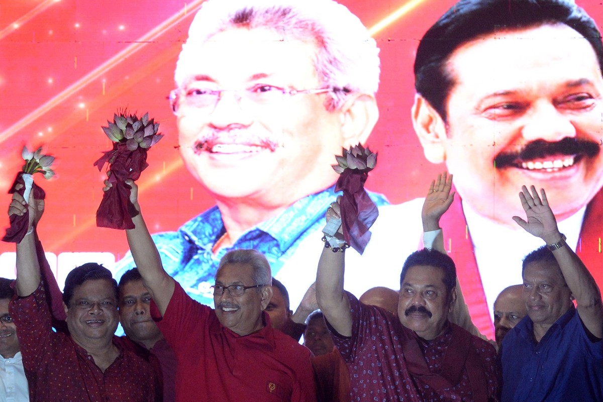 SLPP party presidential candidate Gotabhaya Rajapaksa (second from left) and his brother, former Sri Lanka's president Mahinda Rajapaksa (second from right) wave at supporters during a campaign rally in Homagama, Sri Lanka, on Wednesday. Photo: AFP