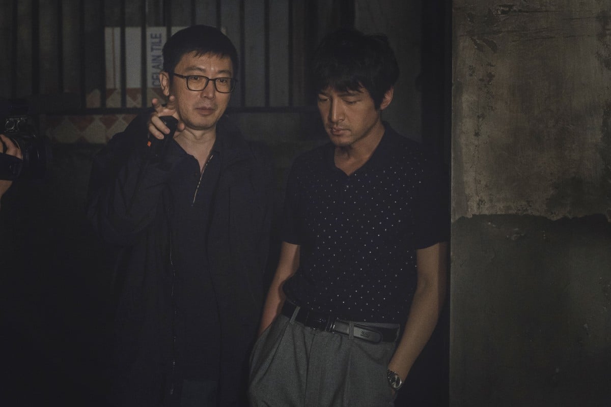 Director Diao Yinan (left) and actor Hu Ge in a still from The Wild Goose Lake.