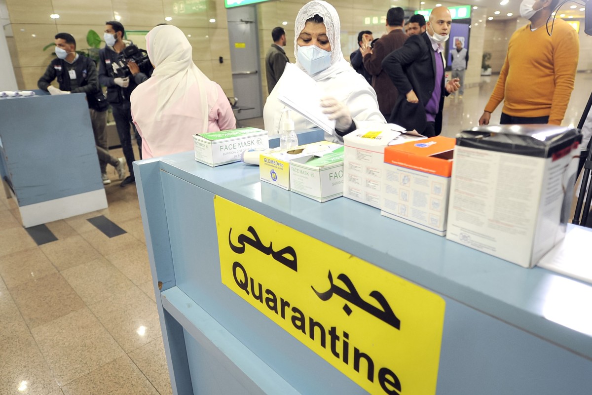 Egyptian quarantine officers prepare to screen travellers arriving at Cairo’s airport. The country has reported its first coronavirus case. Photo: AFP