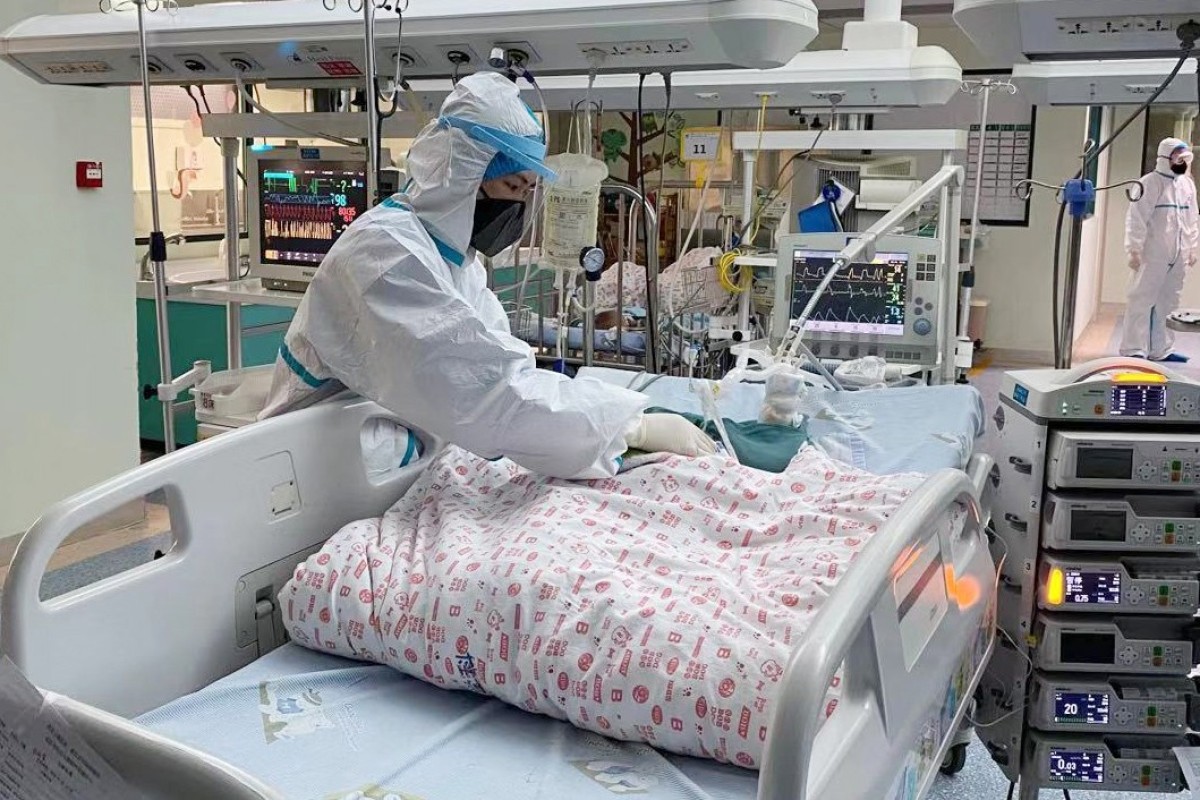 A nurse cares for a 14-month-old baby infected with the novel coronavirus in an ICU isolation ward of Wuhan Children’s Hospital in Wuhan, at the epicentre of the outbreak. Photo: Xinhua