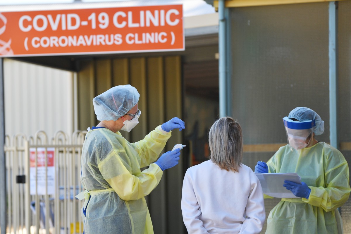 Medical workers stand outside a dedicated Covid-19 testing clinic at a hospital in the Barossa Valley, South Australia, on Tuesday. Photo: EPA