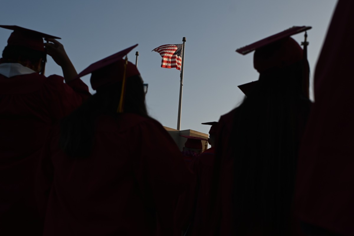 A US flag flies above a graduation ceremony at Pasadena City College last year. Photo: AFP