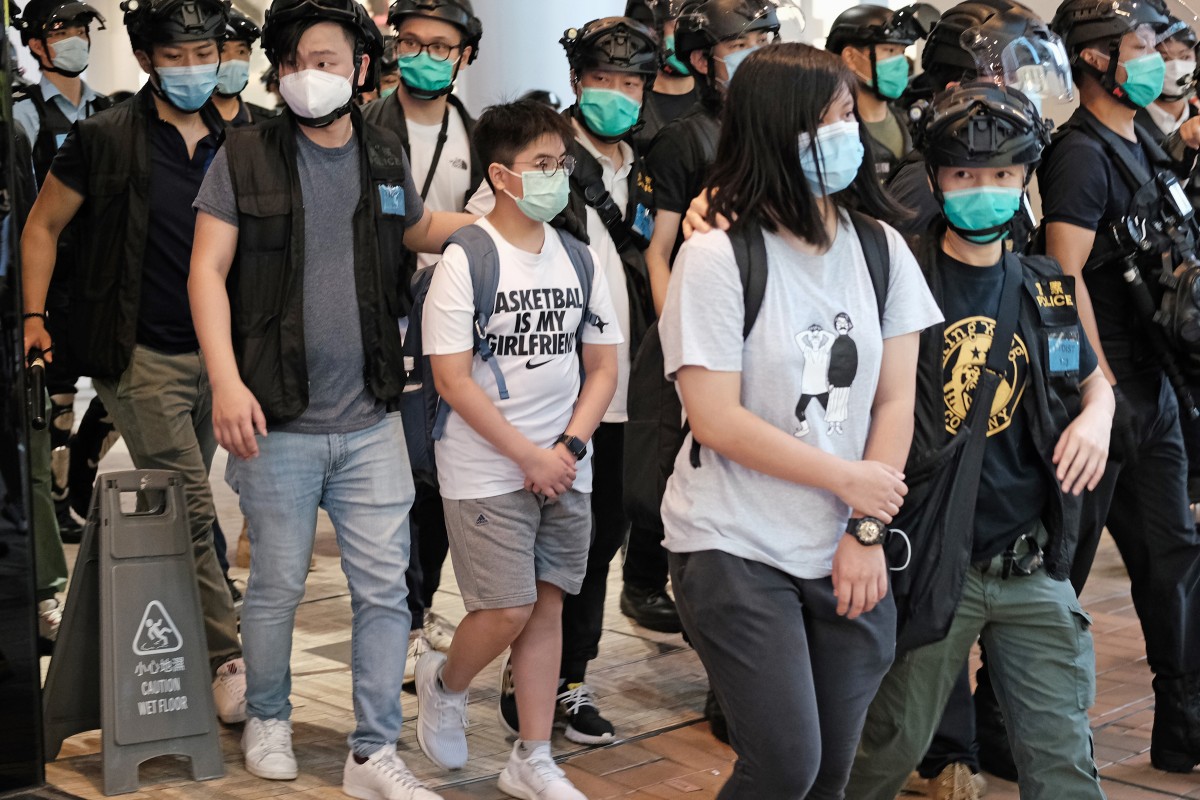 Police detained a 12-year-old boy and a 16-year-old girl covering anti-government protests in Tsim Sha Tsui on Sunday. Photo: Handout