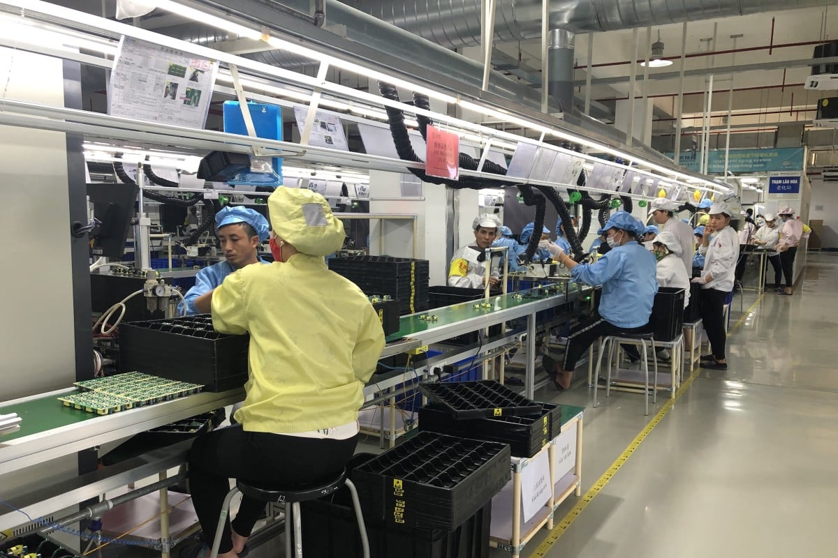 Workers in the adaptor production line in a plant inside Vietnam-China Economic and Trade Cooperation Park. Photo: Cissy Zhou