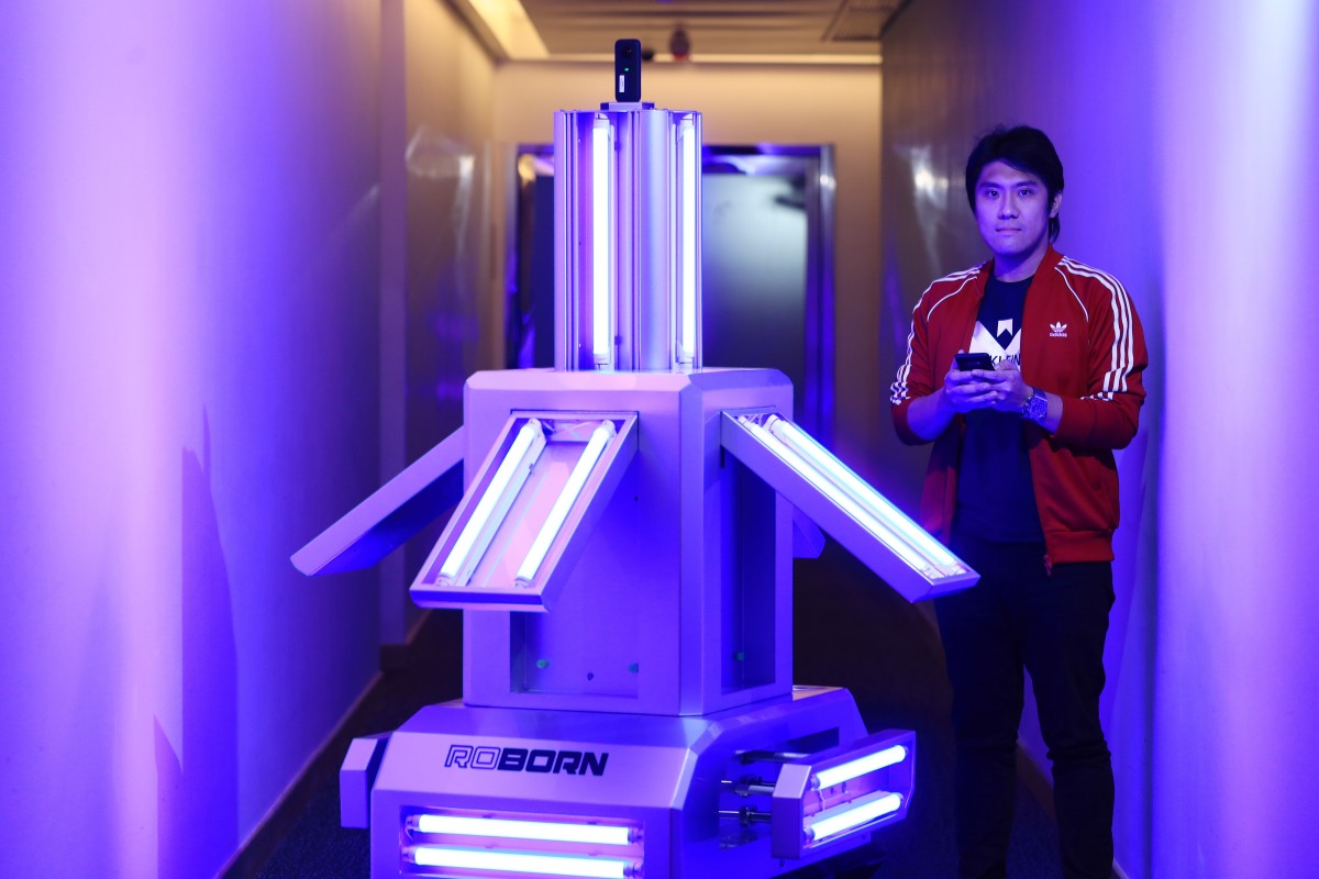 Mark Mak Hin-yu, Roborn’s co-founder, with one of the company’s UV light robots. Photo: May Tse