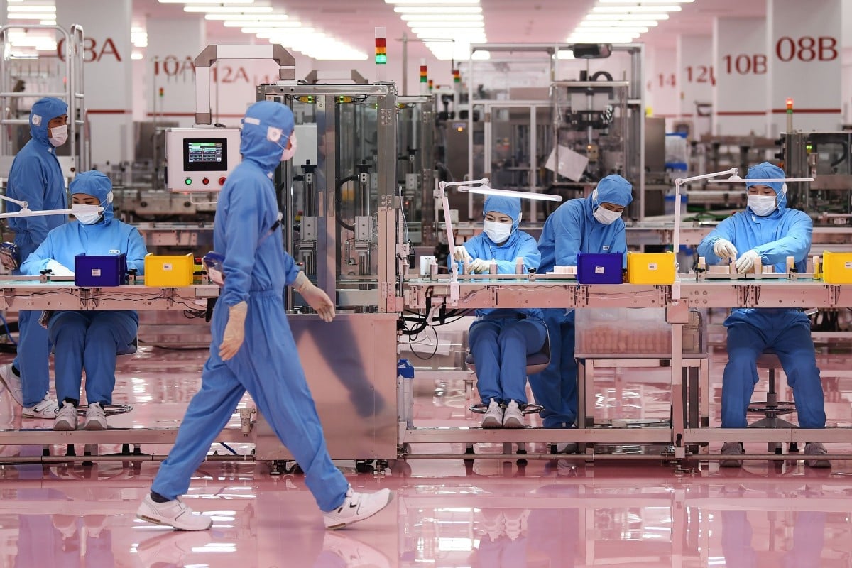Workers at a cosmetics factory in Otawara, Tochigi prefecture. File photo: AFP