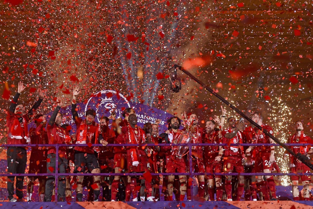 Liverpool players receive long-awaited Premier League trophy on Kop | South China Morning Post