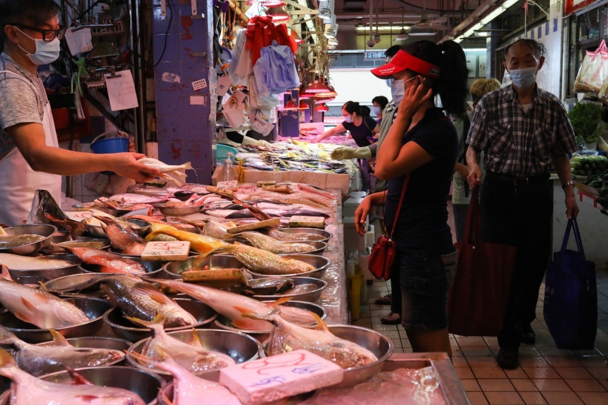 A shopper stops at a fish stall in Kowloon City Market on Wednesday. Photo: Nora Tam