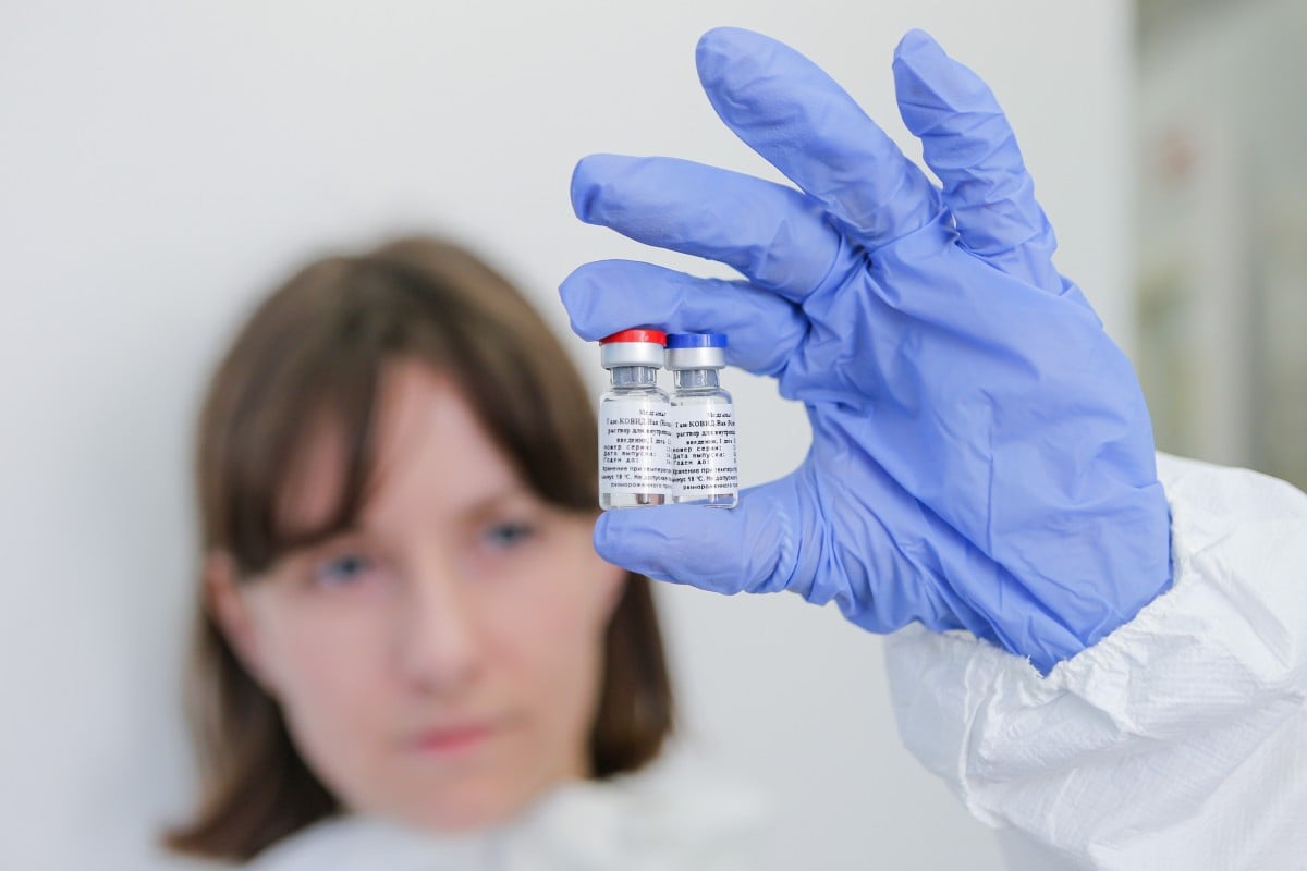 A researcher displays the Covid-19 vaccine developed by the Gamaleya Scientific Research Institute of Epidemiology and Microbiology in Moscow, Russia on Thursday. Photo: Russian Direct Investment Fund handout via Xinhua