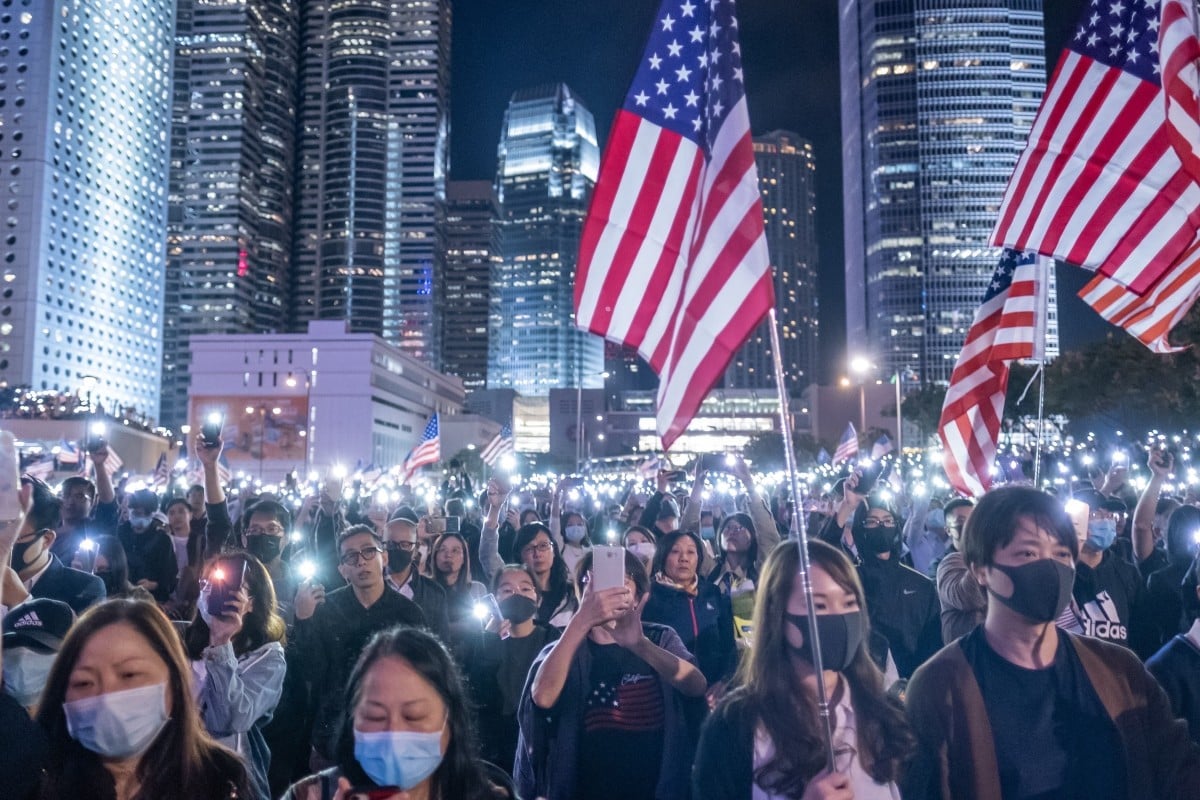 US flags are waved at a pro-democracy demonstration in Hong Kong on November 28. Photo: Justin Chin/Bloomberg