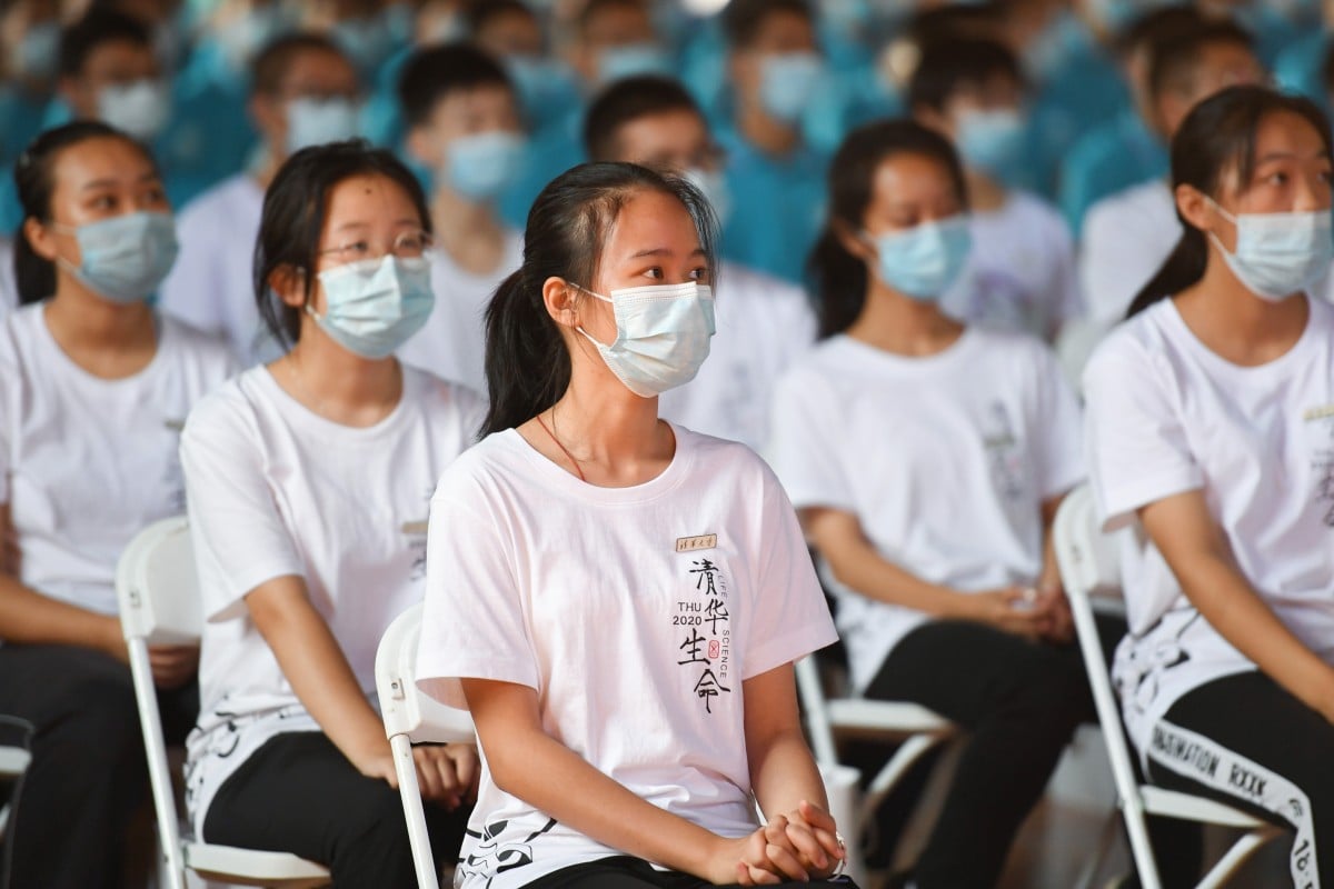 Students take precautions against the coronavirus during the opening ceremony for undergraduates at Tsinghua University in Beijing last month. Photo: Xinhua