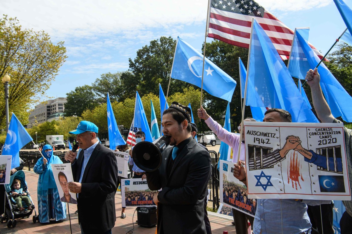 Uygurs of the East Turkistan National Awakening Movement hold a rally to protest the 71st anniversary of the People’s Republic of China in front of the White House on Thursday. Photo: AFP