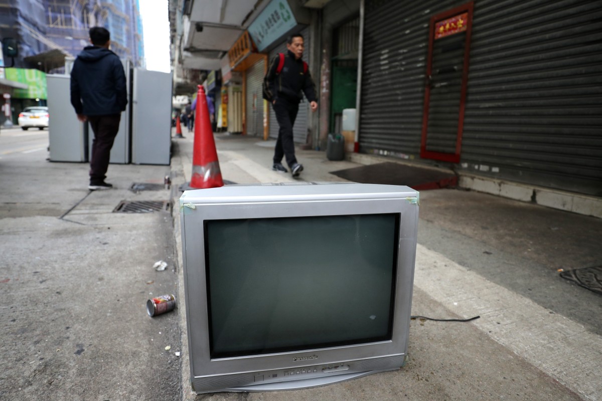 An abandoned television set sits on a street in Sham Shui Po. Hong Kong will end analogue TV services on December 1. Photo: Winson Wong