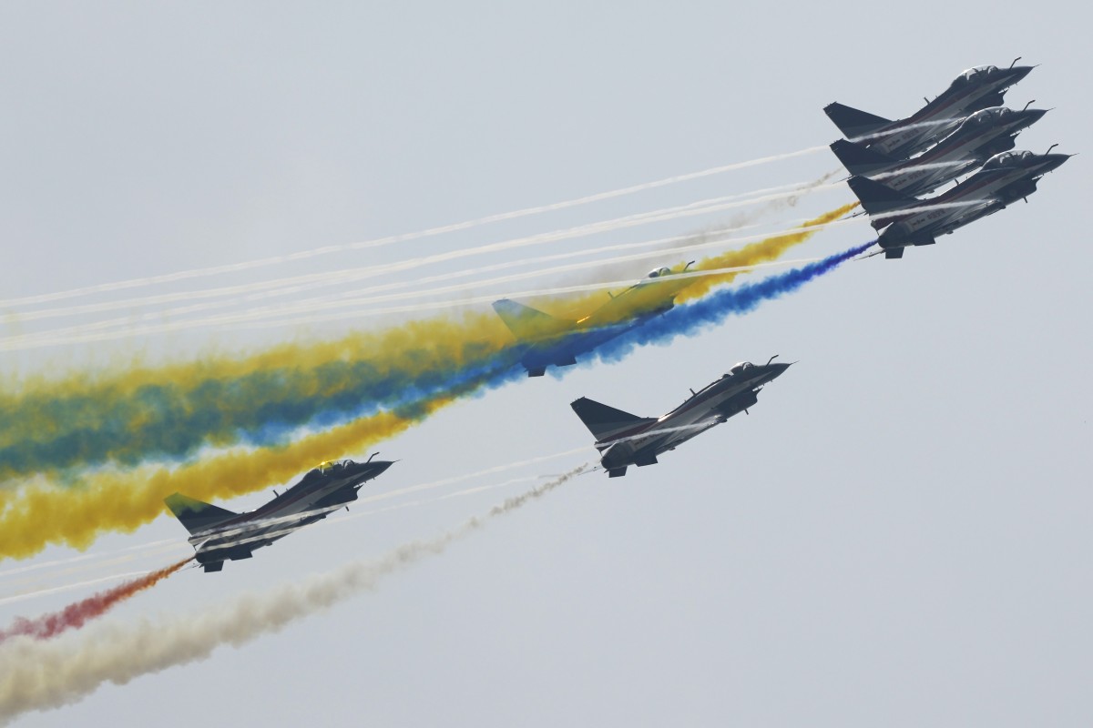 Members of the August 1 aerobatic team perform at the Zhuhai air show. Photo: AP