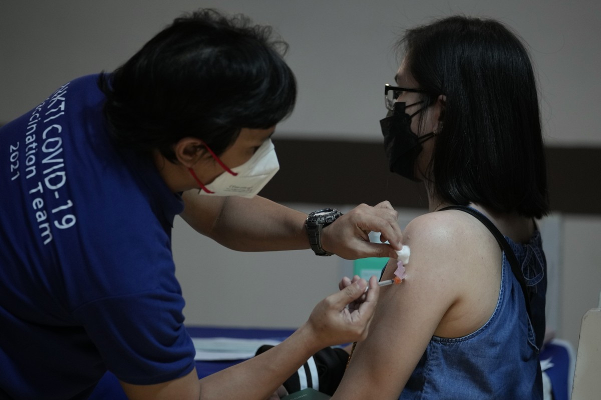 A health worker gets vaccinated against Covid-19 in Quezon City, Philippines. Photo: AP