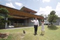 Lim Hock Leng showing SCMP reporter Kok Xinghui around the roof garden where he has trees imported from Taiwan and Japan. Photo: SCMP