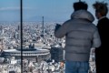 Visitors to the Shibuya Sky observation deck in Tokyo enjoy the view. Photo: AFP