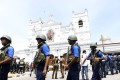 Security staff stand guard outside St. Anthony's Church where a blast took place in Colombo, Sri Lanka. Photo: Xinhua