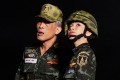 Thailand's King Maha Vajiralongkorn standing with royal noble consort Sineenat Bilaskalayani, also known as Sineenat Wongvajirapakdi. Photo: AFP