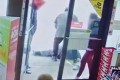 The suspect in a racist attack on an elderly Asian man stands over his victim outside a Vancouver convenience store on March 13, in a video released on Wednesday by Vancouver police. Photo: Handout