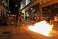 Protesters hurl petrol bombs at riot police in Wan Chai in 2019. Photo: Felix Wong