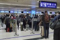 People queue at the Lo Wu border crossing between Hong Kong and Shenzhen in February 2020. Photo: Edmond So