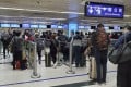 People queue at the Lo Wu border crossing between Hong Kong and Shenzhen in February 2020. Photo: Edmond So
