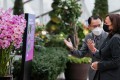 US Vice-President Kamala Harris visits the orchid that was named after her at Gardens by the Bay in Singapore on Tuesday. Photo: AFP