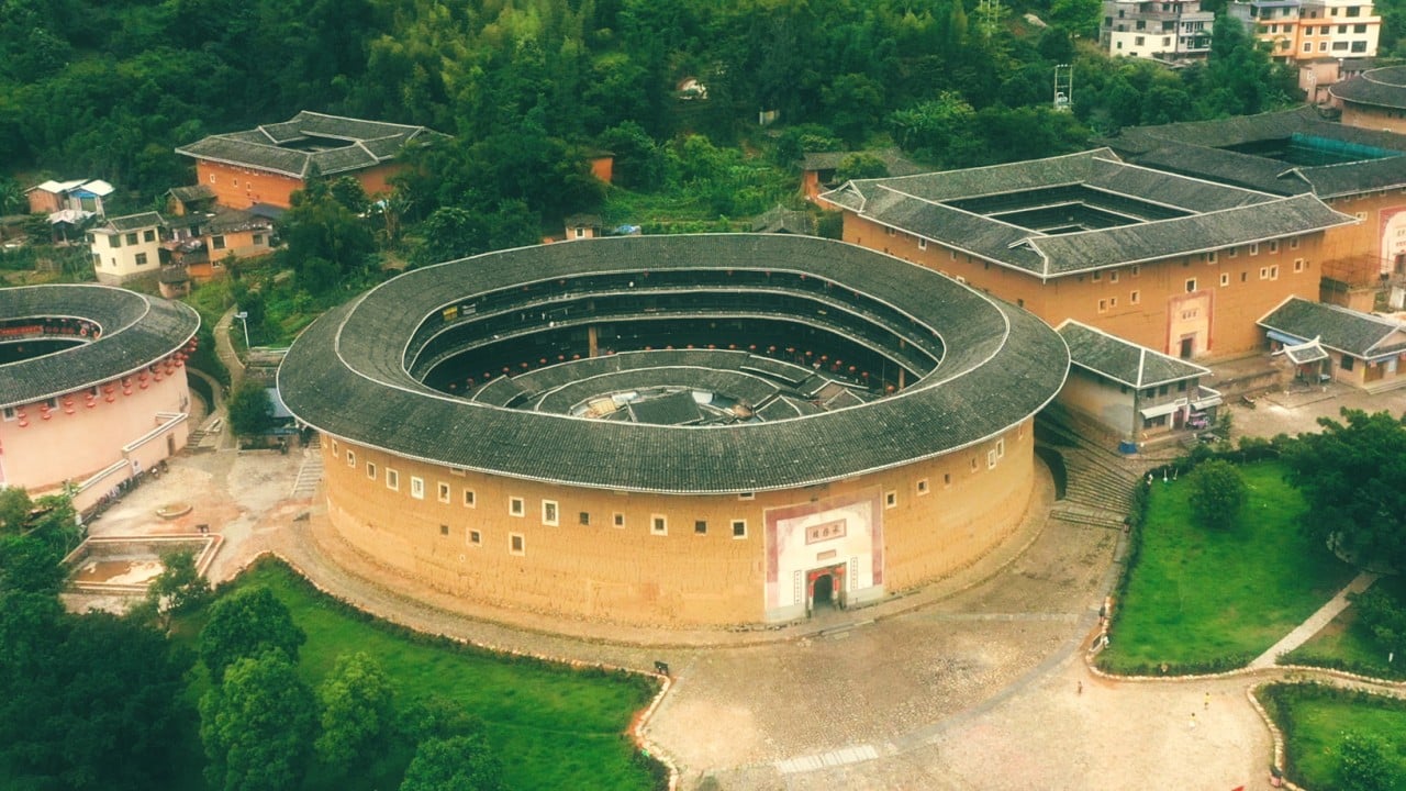What Are Tulou The Round Houses From Disney S Mulan Trailer Goldthread In the tea scene, mulan is seen clearly pouring tea into the four teacups, but when the matchmaker kicks up the table, the hot tea magically disappears into thin air as the cups fly up. what are tulou the round houses from