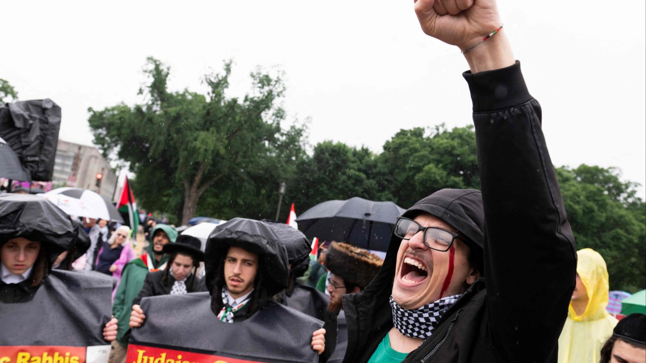 In Washington DC, hundreds of pro-Palestinian protesters rally in rain to mark painful past and present