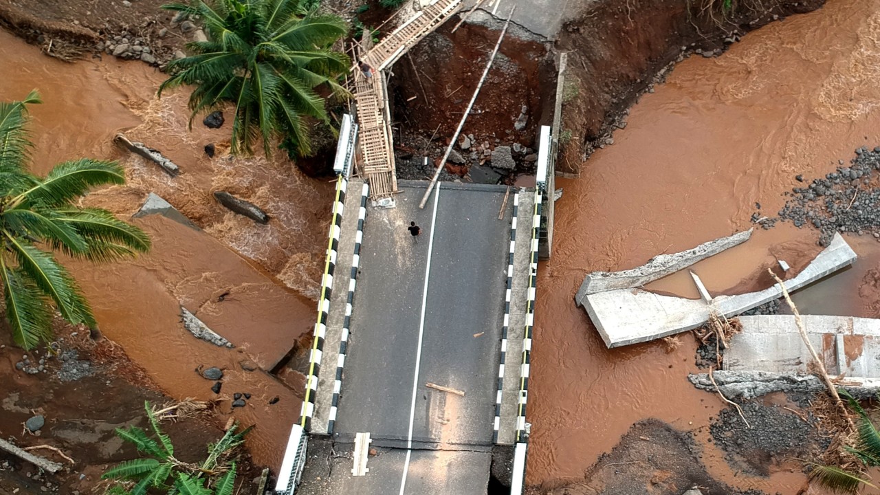 Cows, cars, bridges swept away by Indonesia’s deadly floods