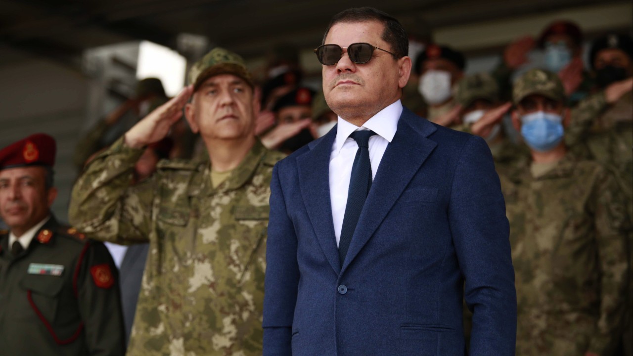 Gunmen clash in Libya as fires erupt at a nearby oil refinery, officials say