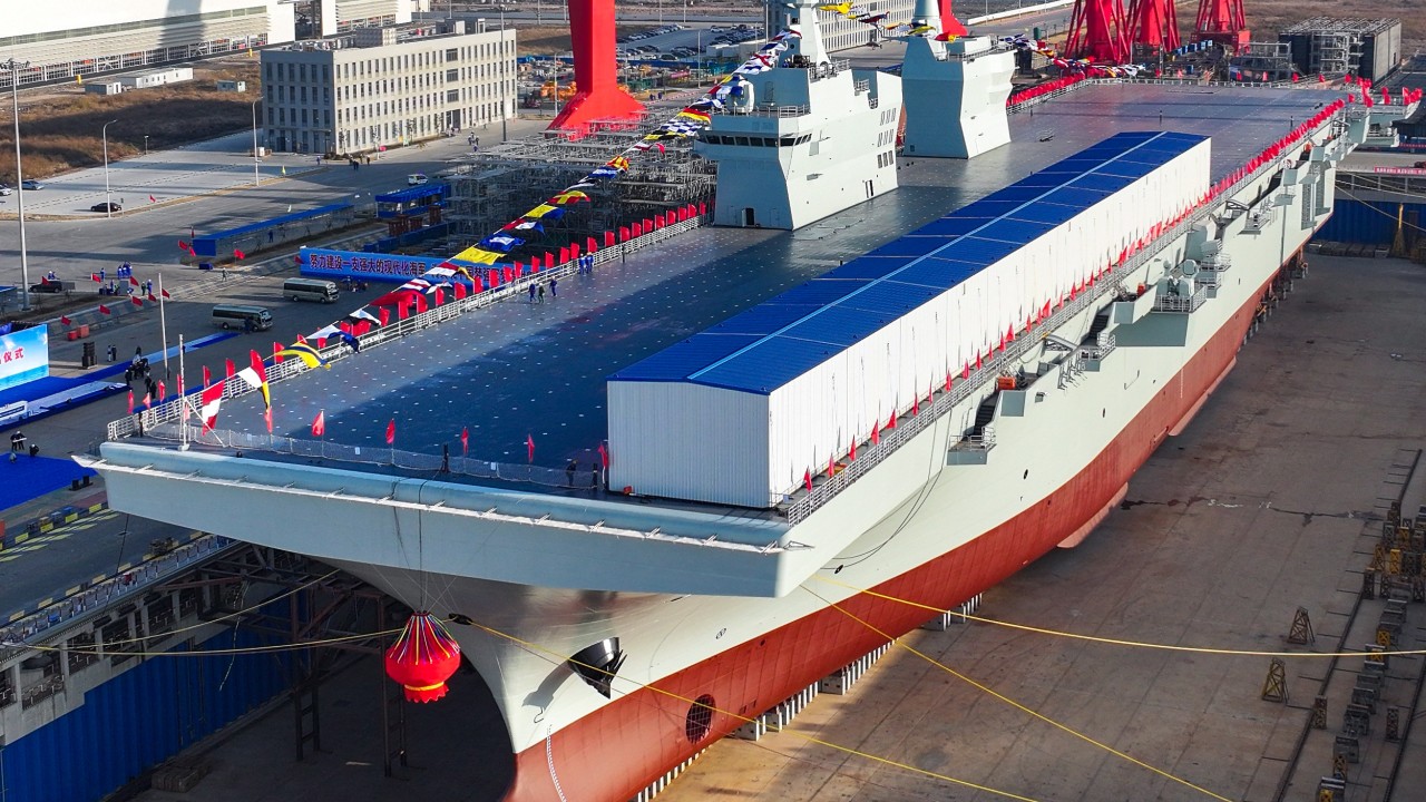 Could China’s newest amphibious warship, the Type 076, be in service next year?