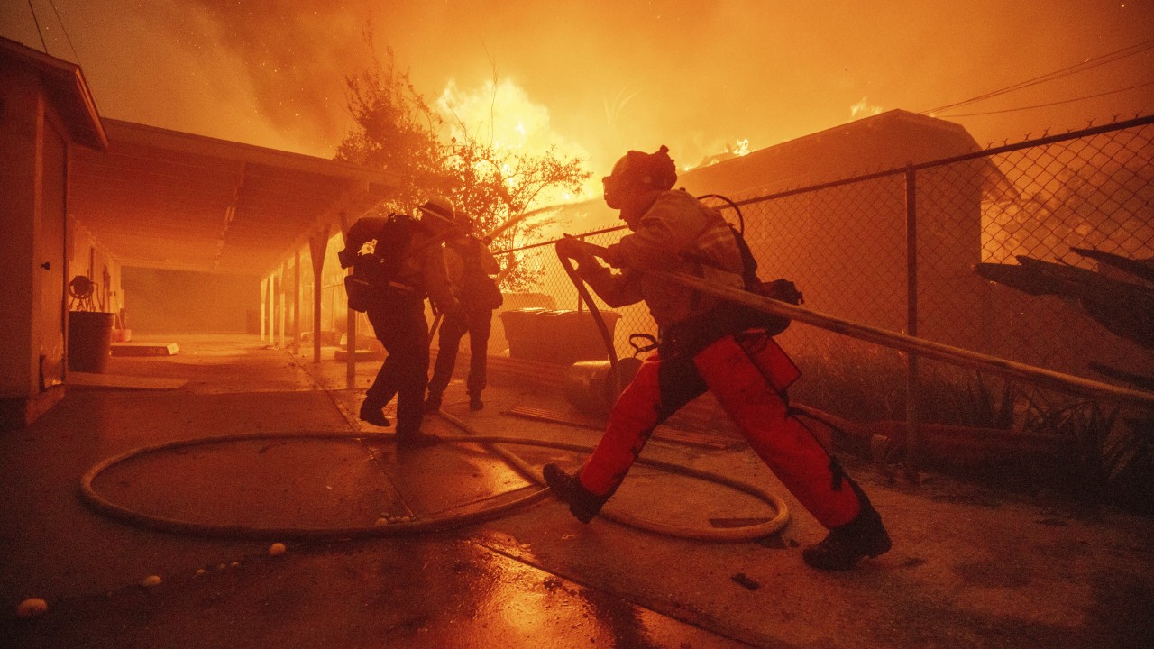 Wildfires rage out of control near Los Angeles, killing at least 2