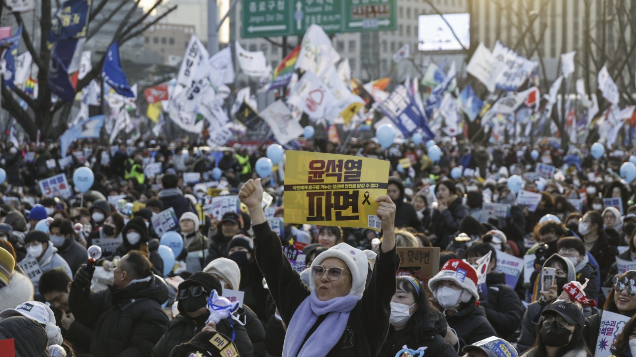 South Korea’s Yoon in court as investigators seek to extend detention