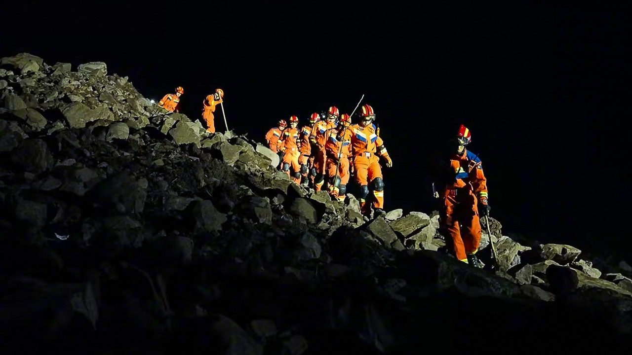 Rescuers in southwest China sift through landslide debris for 28 missing villagers