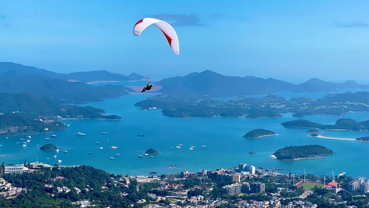 Paraglider rescued from Hong Kong mountain after landing unconscious