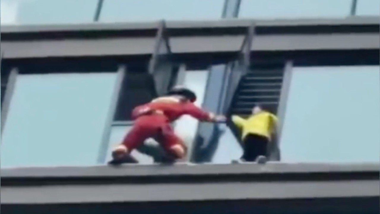Chinese girl rescued after being stranded on window ledge