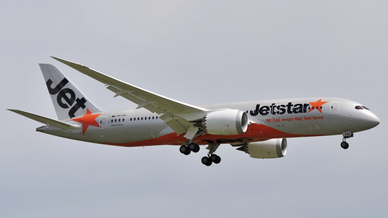 Jetstar flight to Melbourne returns to Bali after woman tries to open plane door mid-flight