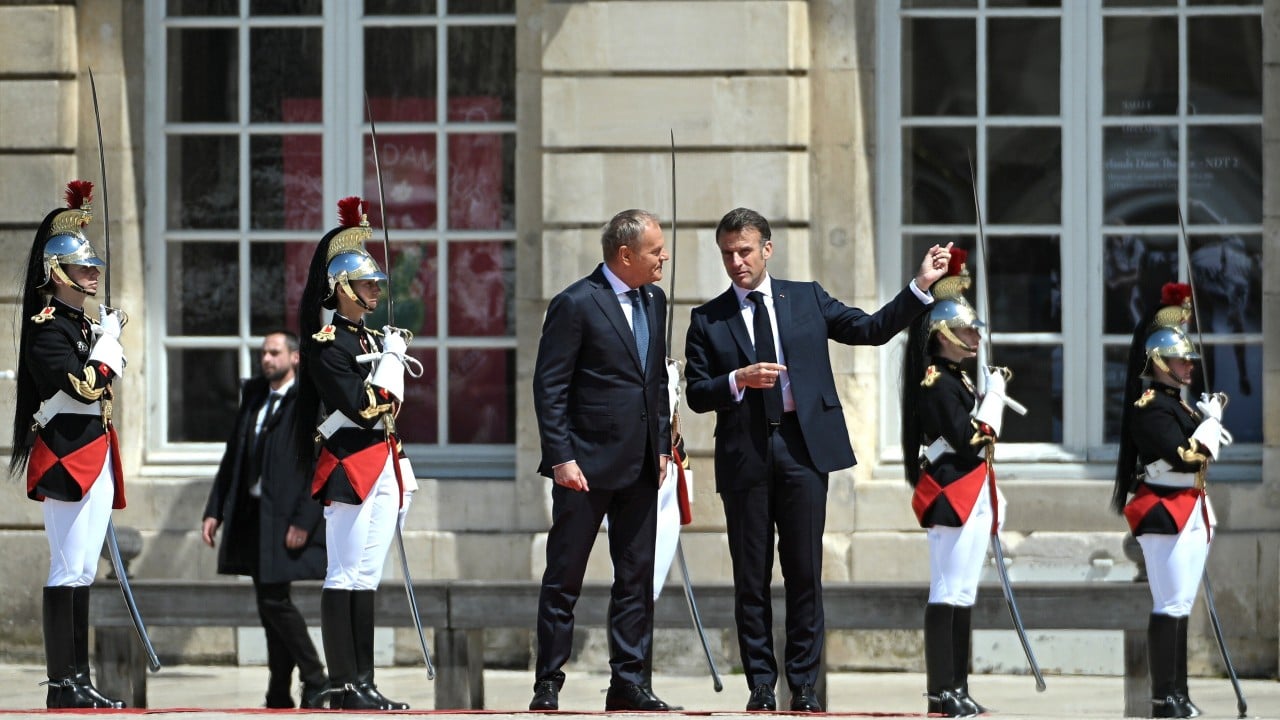 Macron, Tusk sign France-Poland treaty with mutual defence clause