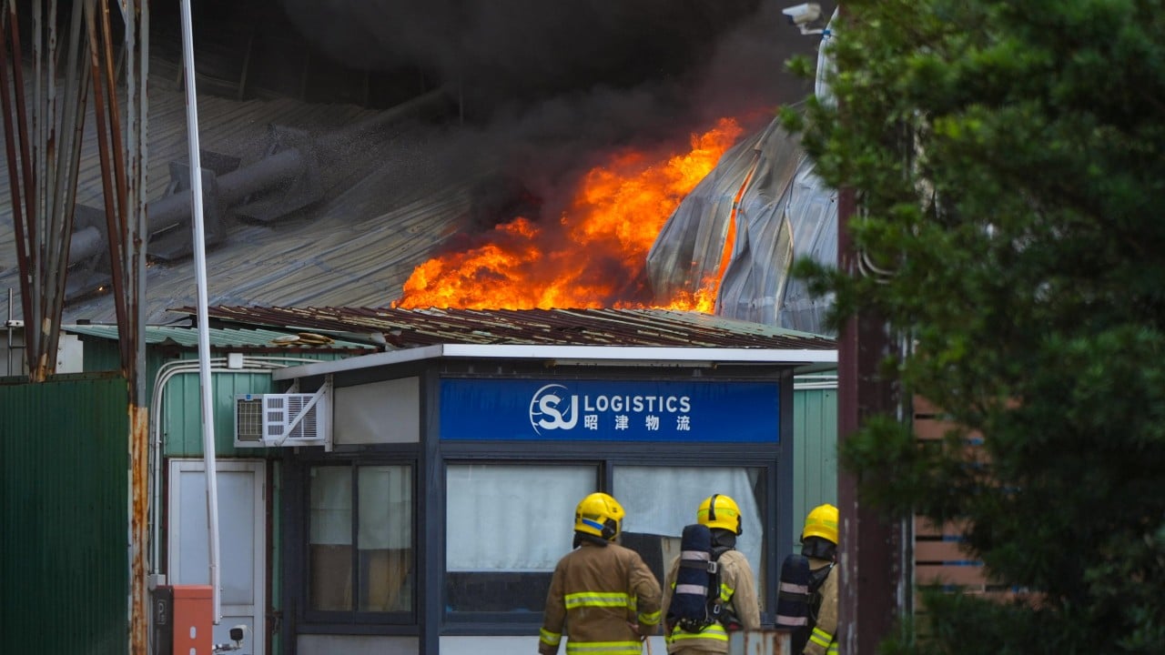 Dozens of firefighters battle No 3 alarm fire at Hong Kong warehouse