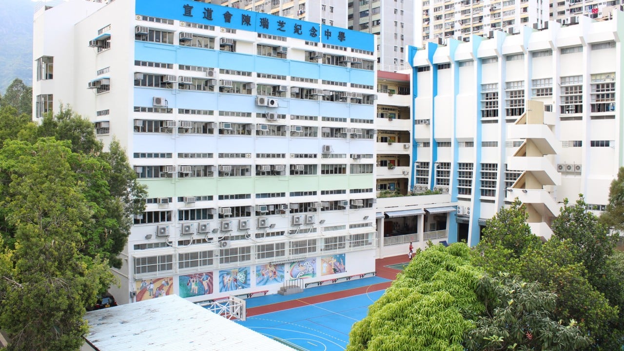Hong Kong vice-principal reported for allegedly waving scissors at hair-row boy