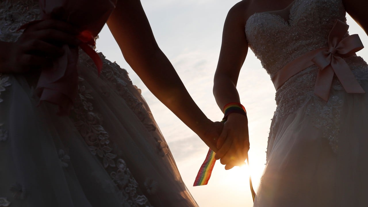 Hong Kong court backs lesbian couple on registering as parents of son together