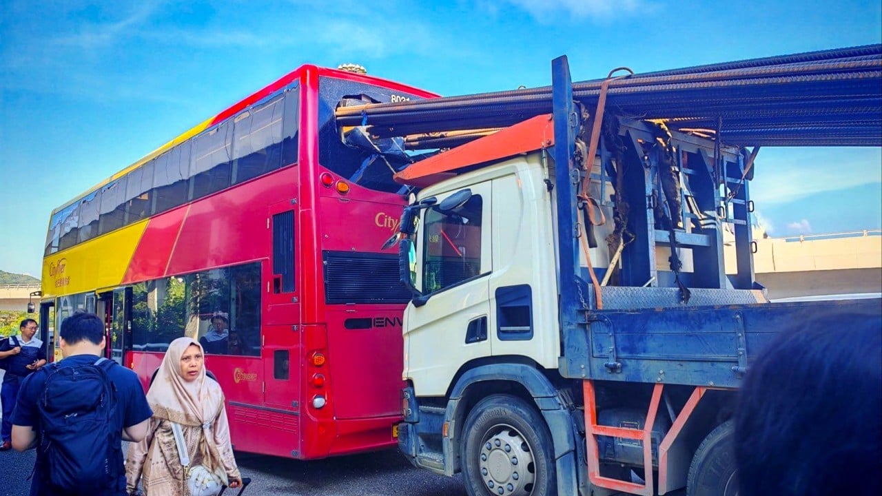 Passengers escape injury as truck with steel rods hits bus in Hong Kong
