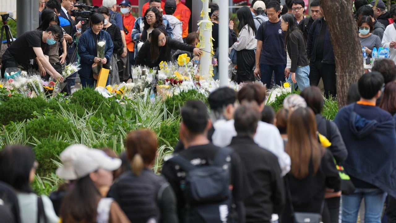 Mourners gather at Hong Kong fire site as 1,500 residents relocated